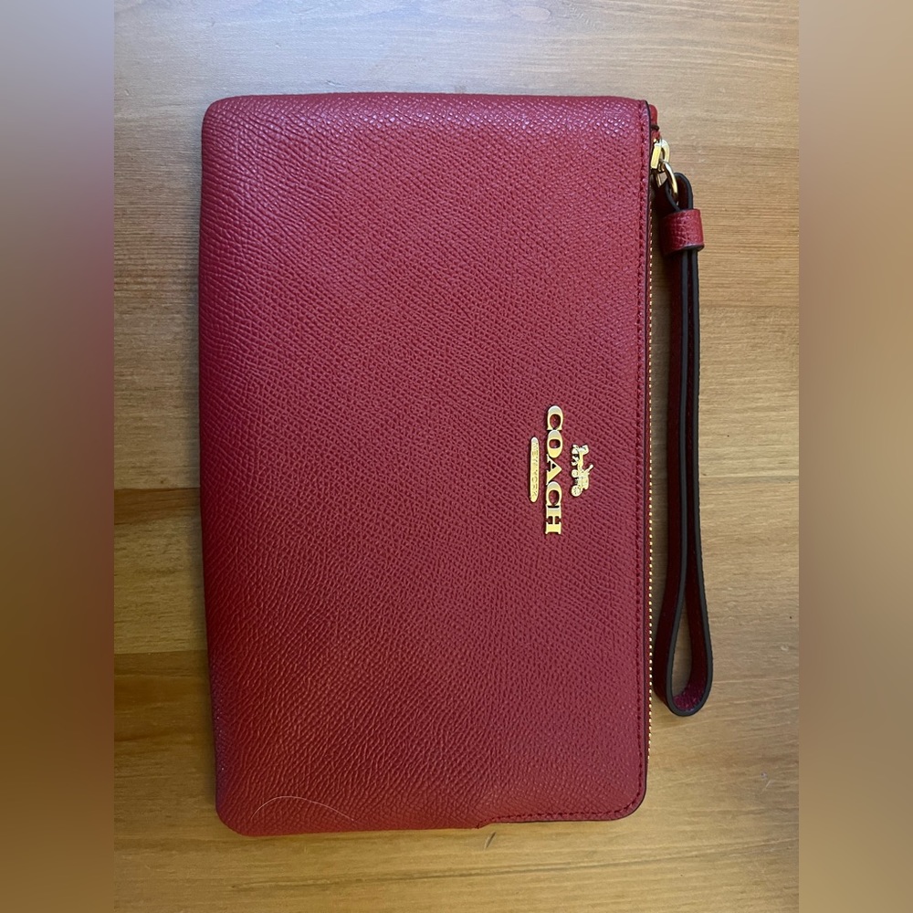 Coach wristlet large corner zip, never used, pretty red color